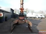 1997 Atlas 1704 material handler front view with grab attachment