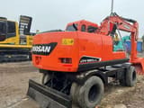 2022 Doosan DX150W-9C wheel excavator, rear three-quarter view