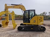 Caterpillar 310 Mini Excavator, side profile view