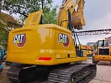 2024 Caterpillar 320GC crawler excavator, rear three-quarter view