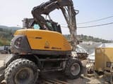 2013 Mecalac 714 MW wheel excavator, side profile view