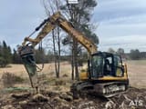 2021 Caterpillar 313 crawler excavator with hydraulic breaker attachment, side view