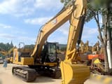 2023 Caterpillar 320GC crawler excavator, front three-quarter view