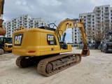 2018 Caterpillar 323 crawler excavator, rear three-quarter view