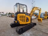 2024 Komatsu PC50MR mini excavator, rear three-quarter view