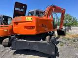 2023 Hitachi Zaxis 130 wheel excavator, rear three-quarter view