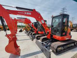 Kubota U55-4 mini excavator, side view
