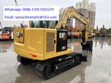 2026 Caterpillar 307 mini excavator, rear three-quarter view