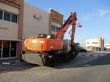 2017 Hitachi Zaxis 360W wheel excavator, rear three-quarter view