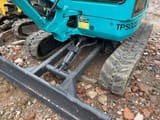 Kubota KX135 mini excavator front blade and tracks detail