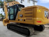 Caterpillar 320E crawler excavator, rear three-quarter view