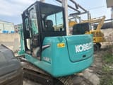 Kobelco SK60 mini excavator, rear three-quarter view