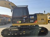 2023 Caterpillar 323DL excavator, side profile view