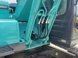 2022 Kobelco SK130LC-11 crawler excavator side view of boom and cab