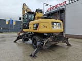 2010 Caterpillar M318D MH demolition excavator rear three-quarter view