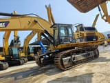 2019 Caterpillar 374DL crawler excavator, side profile view