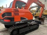 2023 Doosan DX75-9C mini excavator, rear three-quarter view
