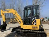 2025 Komatsu PC55 MR mini excavator, side view