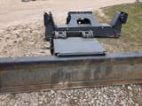 2024 Doosan wheel excavator blade and outrigger assembly, front view