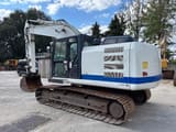 2013 Caterpillar 320E crawler excavator, rear three-quarter view