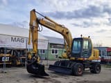 1998 Komatsu PW130ES-6K wheel excavator, side view