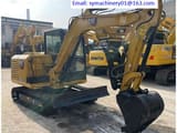 2023 Caterpillar 305.5E2 mini excavator, front three-quarter view