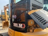 2024 Caterpillar 303.5E mini excavator, close-up of open engine compartment