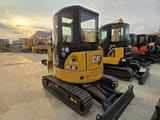 2024 Caterpillar 303.5E mini excavator, rear three-quarter view