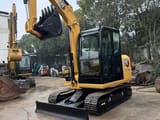 2021 Caterpillar 305.5E2 mini excavator, front three-quarter view