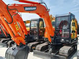 2024 Doosan DH55 mini excavator, front three-quarter view