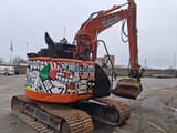 2022 Hitachi ZX135US-6 crawler excavator, rear three-quarter view