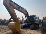 2024 Caterpillar 329 crawler excavator, front three-quarter view