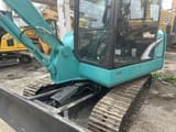 Kobelco SK60 mini excavator, side view