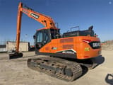 2024 Develon DX225 LC-7 crawler excavator, rear three-quarter view