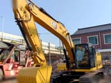 2021 Caterpillar 320 crawler excavator, front three-quarter view