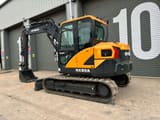 2023 Hyundai HX85A mini excavator, rear three-quarter view