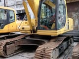 2016 Komatsu PC220 excavator, front three-quarter view