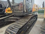 2024 Sany SY235 crawler excavator, side view of cab and tracks