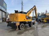 2016 Caterpillar MH3022 wheel excavator rear three-quarter view
