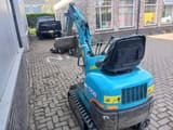 2001 Kubota K-008 mini excavator, rear three-quarter view