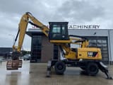 2010 Caterpillar M318D MH demolition excavator side view