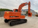 2021 Doosan DX140LC crawler excavator, rear three-quarter view