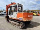 1990 Hitachi EX60 crawler excavator, rear three-quarter view