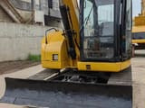 2022 Caterpillar 308D mini excavator front view with blade