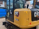 2018 Caterpillar 305.5E2 crawler excavator, rear three-quarter view