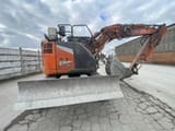 2022 Hitachi Zaxis 135US-7 crawler excavator, rear three-quarter view