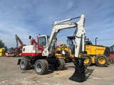 1997 Takeuchi TB070W wheel excavator, side view