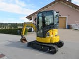 2023 Komatsu PC26 MR-5 mini excavator, front three-quarter view