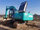 Kobelco SK210 crawler excavator, rear three-quarter view