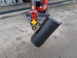 Mole M12 mini excavator, front view with bucket